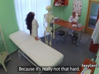 Medical practitioner banging student nurse